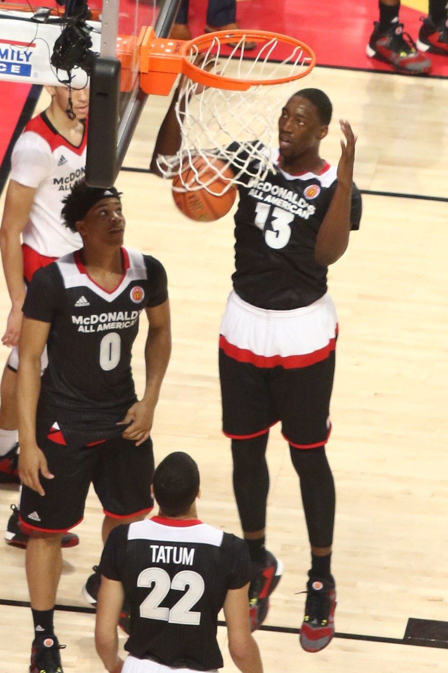 Adebayo dunks at the 2016 McDonald's All-American Game. Below him, wearing No. 22: a high school senior named Jayson Tatum