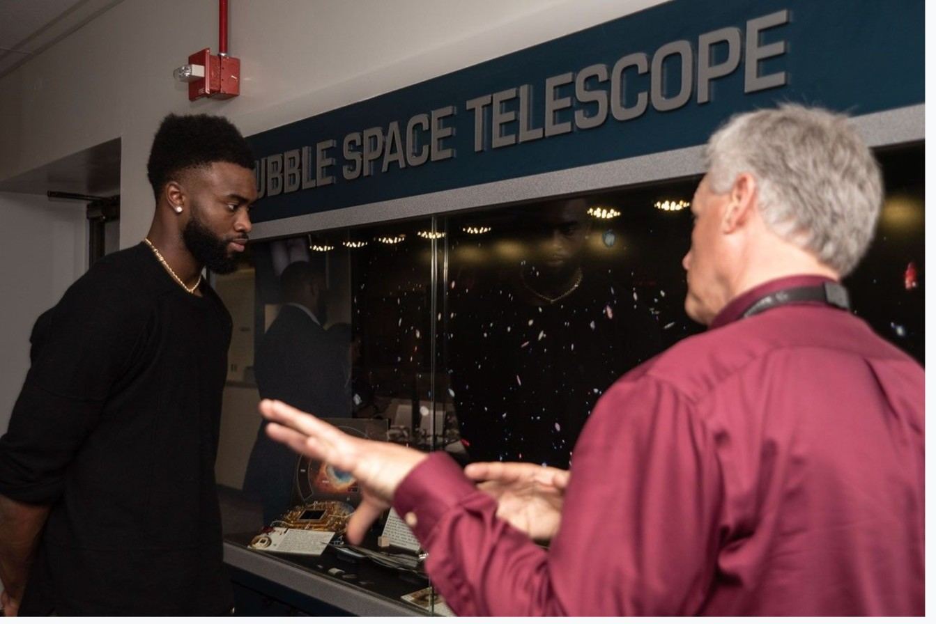 Jaylen Brown looking at Hubble Space Telescope hardware at NASA