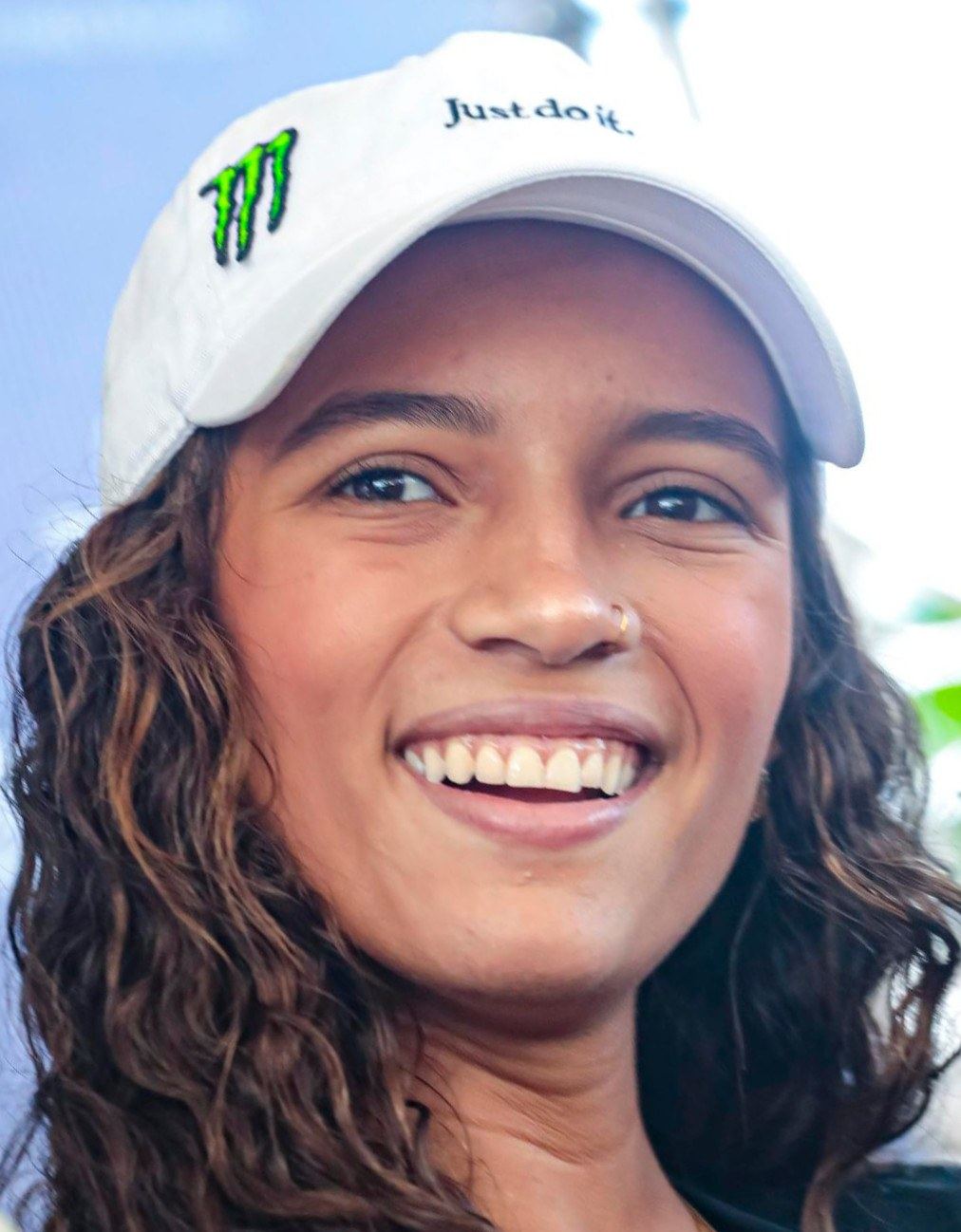 Rayssa Leal smiling in a white cap